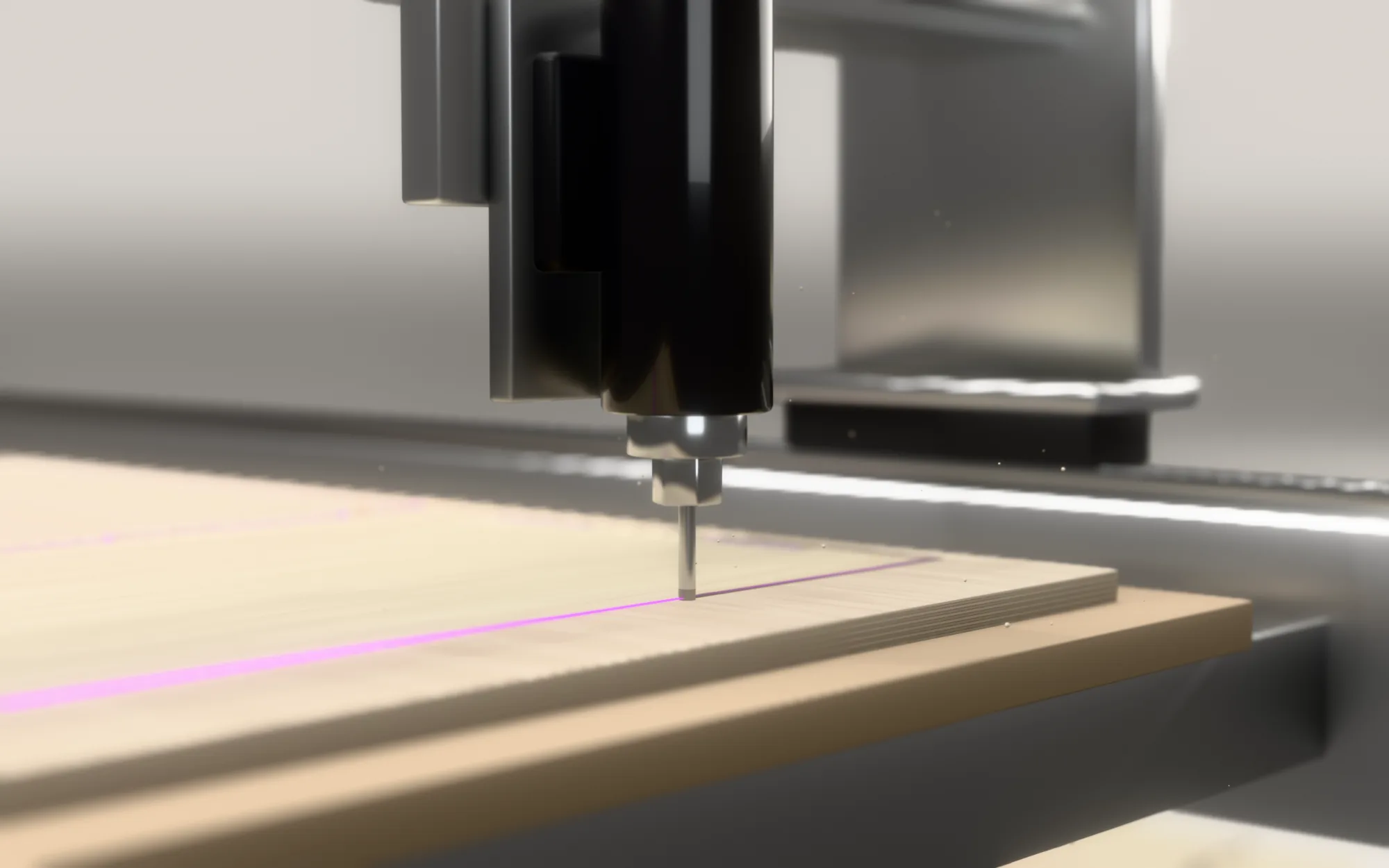 Close-up of the spindle and cutter routing a groove in a plywood sheet
